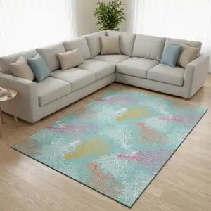 Photo of Aqua Orange And Pink Geometric Washable Area Rug With UV Protection