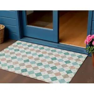 Photo of Aqua Peach And Ivory Geometric Washable Indoor Outdoor Area Rug