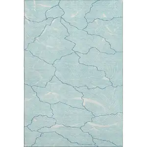 Photo of Aqua Teal And Ivory Abstract Washable Area Rug With UV Protection