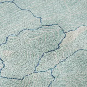 Photo of Aqua Teal And Ivory Abstract Washable Area Rug With UV Protection