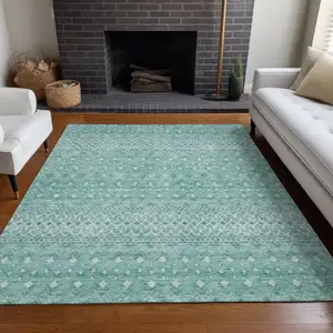 Photo of Aqua Teal Blue And Ivory Tribal Washable Indoor Outdoor Area Rug