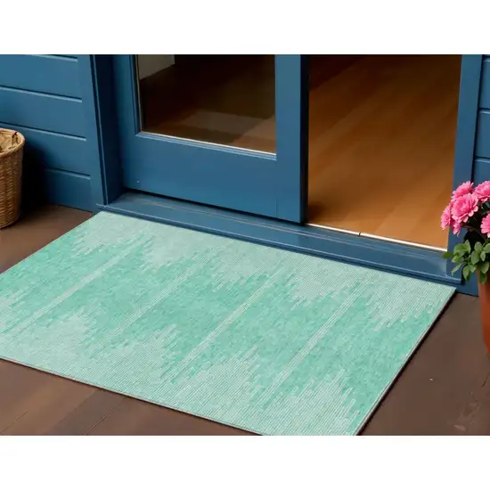 Aquamarine And Ivory Abstract Washable Indoor Outdoor Area Rug Photo 1
