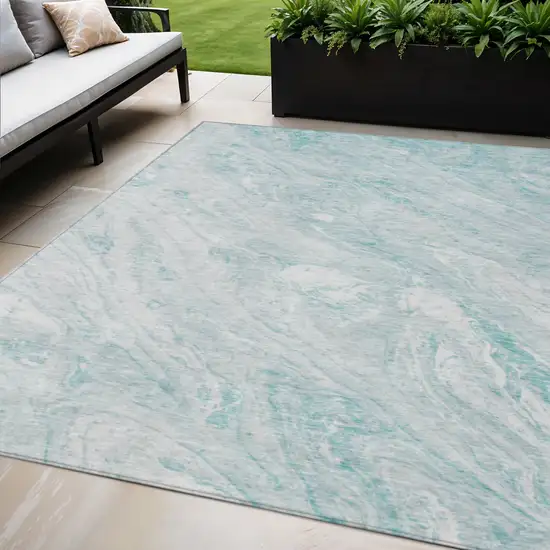 Aquamarine Aqua And Ivory Abstract Washable Indoor Outdoor Area Rug Photo 1