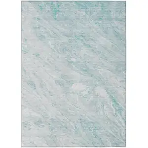 Photo of Aquamarine Aqua And Ivory Abstract Washable Indoor Outdoor Area Rug