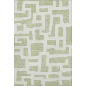 Photo of Artichoke Green And Ivory Abstract Geometric Washable Area Rug With UV Protection