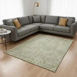 Photo of Artichoke Green And Ivory Abstract Geometric Washable Area Rug With UV Protection