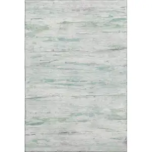 Photo of Artichoke Green And Ivory Abstract Washable Area Rug With UV Protection