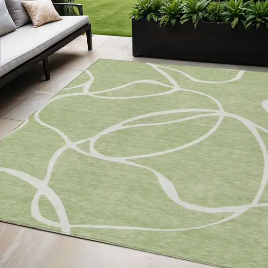 Artichoke Green And Ivory Abstract Washable Indoor Outdoor Area Rug Photo 1