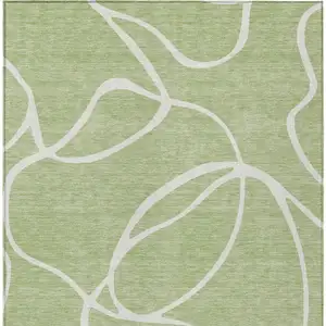 Photo of Artichoke Green And Ivory Abstract Washable Indoor Outdoor Area Rug