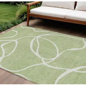 Photo of Artichoke Green And Ivory Abstract Washable Indoor Outdoor Area Rug
