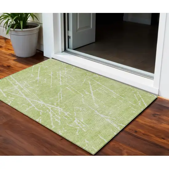 Artichoke Green And Ivory Abstract Washable Indoor Outdoor Area Rug Photo 1