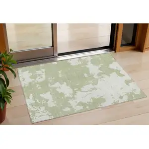 Photo of Artichoke Green And Ivory Abstract Washable Indoor Outdoor Area Rug