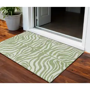 Photo of Artichoke Green And Ivory Animal Print Washable Indoor Outdoor Area Rug