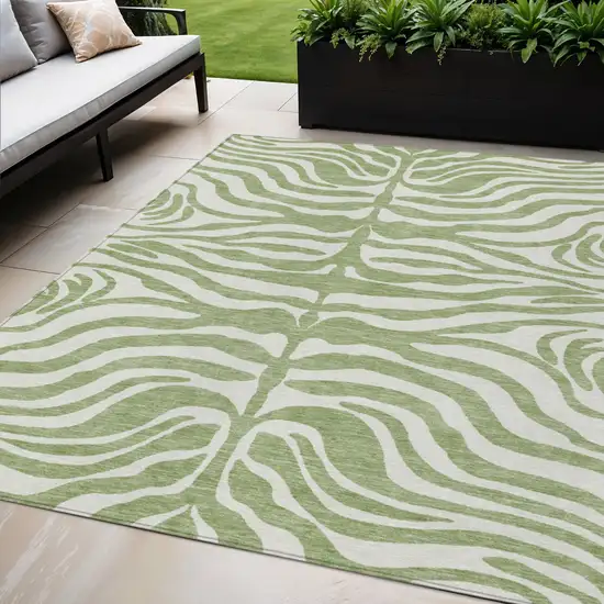 Artichoke Green And Ivory Animal Print Washable Indoor Outdoor Area Rug Photo 1