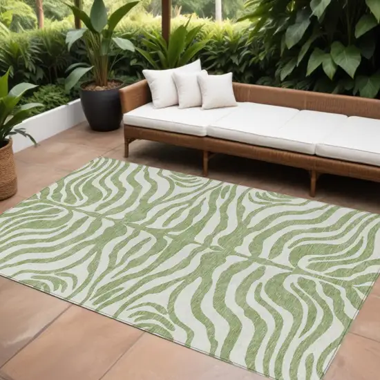 Artichoke Green And Ivory Animal Print Washable Indoor Outdoor Area Rug Photo 1