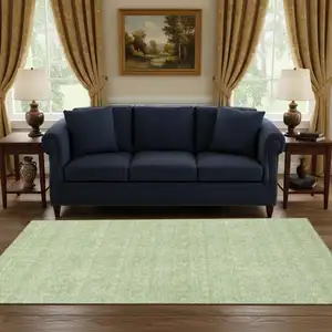 Photo of Artichoke Green And Ivory Floral Washable Area Rug With UV Protection