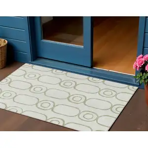 Photo of Artichoke Green And Ivory Geometric Washable Indoor Outdoor Area Rug