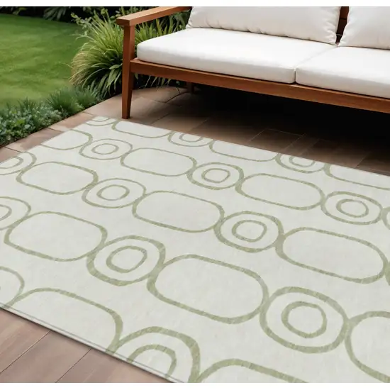 Artichoke Green And Ivory Geometric Washable Indoor Outdoor Area Rug Photo 1