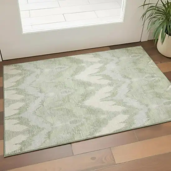 Artichoke Green And Ivory Ikat Washable Area Rug With UV Protection Photo 1