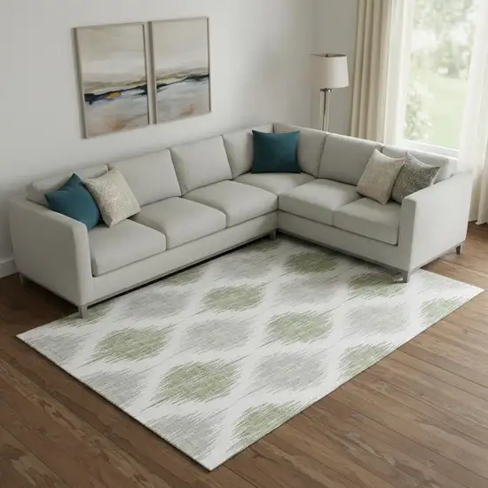 Artichoke Green And Ivory Ikat Washable Area Rug With UV Protection Photo 1