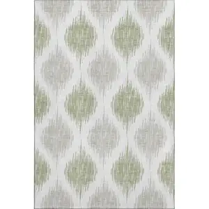 Photo of Artichoke Green And Ivory Ikat Washable Area Rug With UV Protection