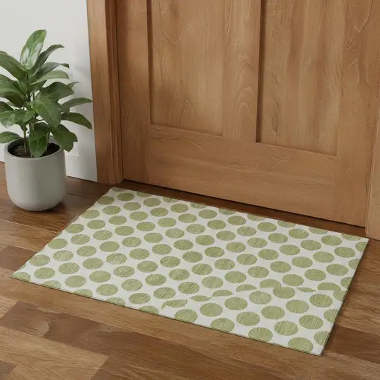 Artichoke Green And Ivory Polka Dot Washable Area Rug With UV Protection Photo 1