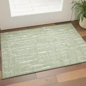 Photo of Artichoke Green And Ivory Vermicular Washable Area Rug With UV Protection