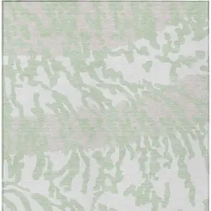 Photo of Artichoke Green Beige And Ivory Animal Print Washable Indoor Outdoor Area Rug