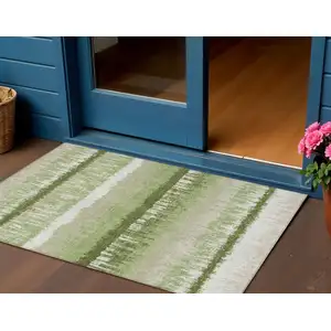 Photo of Artichoke Green Beige And Ivory Striped Washable Indoor Outdoor Area Rug