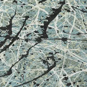 Photo of Artichoke Green Black And Ivory Abstract Washable Indoor Outdoor Area Rug