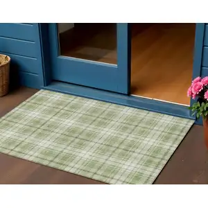 Photo of Artichoke Green Brown And Ivory Plaid Washable Indoor Outdoor Area Rug
