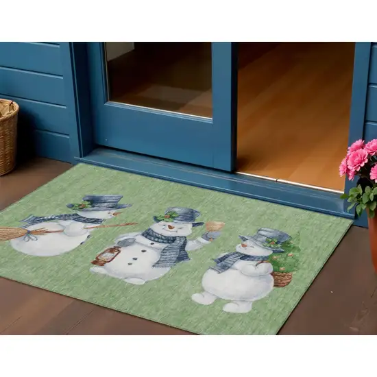 Artichoke Green Denim Blue And Ivory Snowmen Washable Indoor Outdoor Area Rug Photo 1