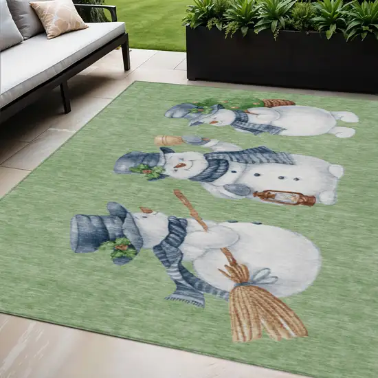 Artichoke Green Denim Blue And Ivory Snowmen Washable Indoor Outdoor Area Rug Photo 1