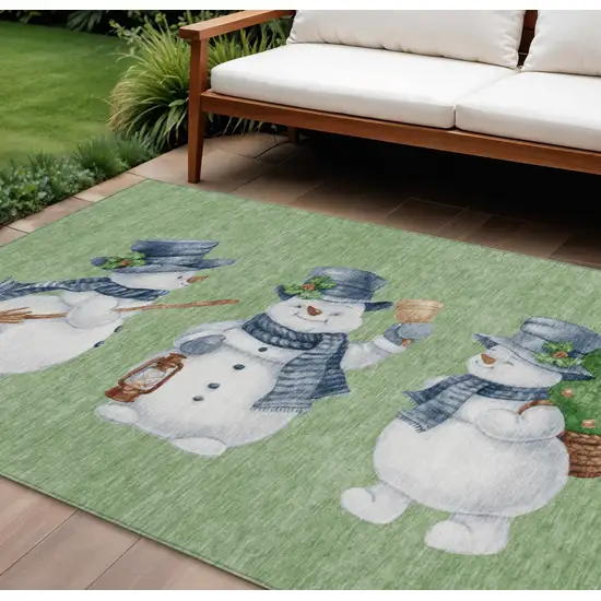 Artichoke Green Denim Blue And Ivory Snowmen Washable Indoor Outdoor Area Rug Photo 1