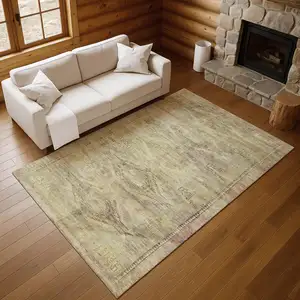 Photo of Artichoke Green Gold And Beige Abstract Geometric Washable Area Rug With UV Protection