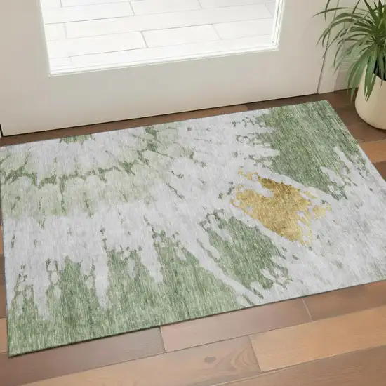 Artichoke Green Gold And Ivory Abstract Washable Area Rug With UV Protection Photo 1