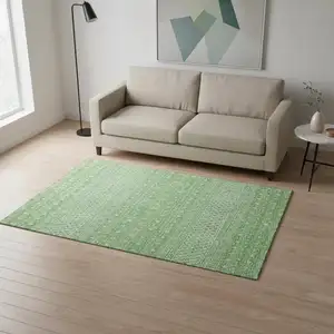 Photo of Artichoke Green Gold And Ivory Tribal Washable Area Rug With UV Protection