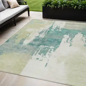 Photo of Artichoke Green Ivory And Aqua Abstract Washable Indoor Outdoor Area Rug