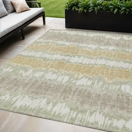 Artichoke Green Ivory And Gold Striped Washable Indoor Outdoor Area Rug Photo 1