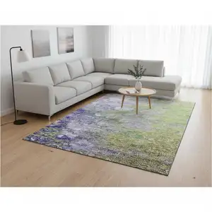 Photo of Artichoke Green Purple And Ivory Abstract Washable Area Rug With UV Protection