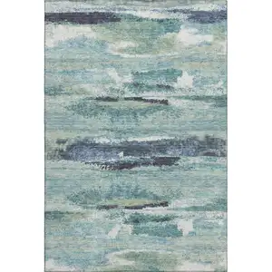 Photo of Artichoke Green Teal And Ivory Abstract Washable Area Rug With UV Protection