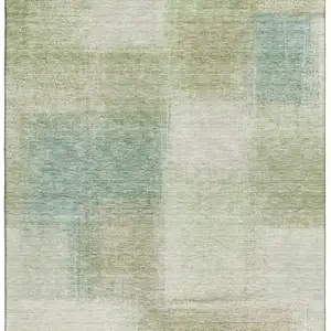Photo of Artichoke Green Teal Blue And Beige Abstract Washable Area Rug With UV Protection