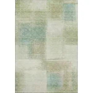Photo of Artichoke Green Teal Blue And Beige Abstract Washable Area Rug With UV Protection