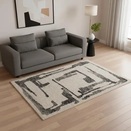 Beige And Black Abstract Area Rug Photo 1