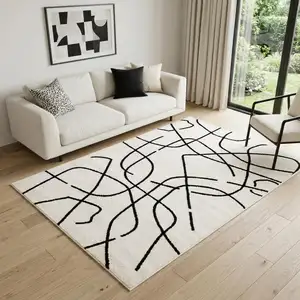 Photo of Beige And Black Abstract Area Rug