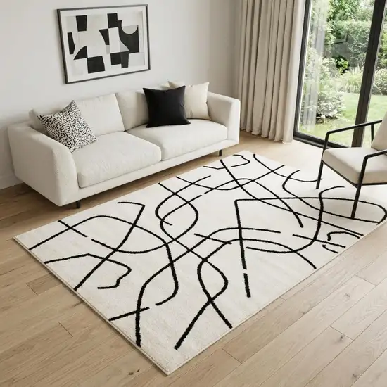 Beige And Black Abstract Area Rug Photo 1