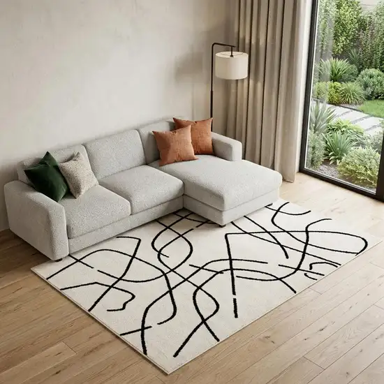 Beige And Black Abstract Area Rug Photo 1