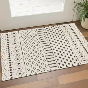Photo of Beige And Black Tribal Washable Area Rug