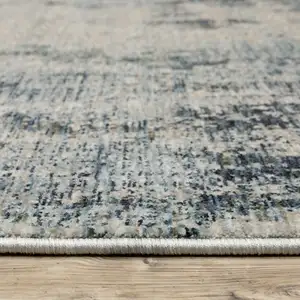 Photo of Beige And Blue Abstract Area Rug With Fringe