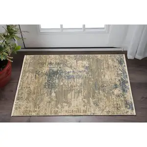 Photo of Beige And Blue Abstract Area Rug With Fringe